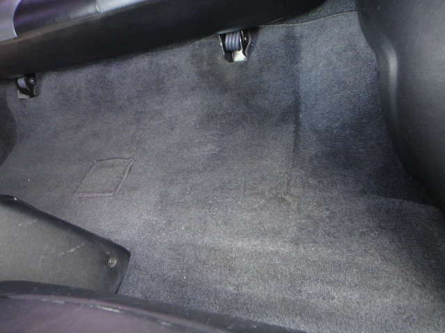 Carpet with no wear behind driver seat
