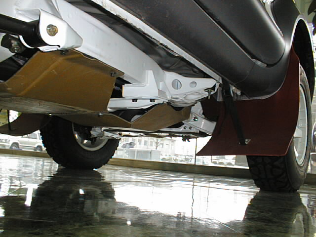 Composite racing skid plate