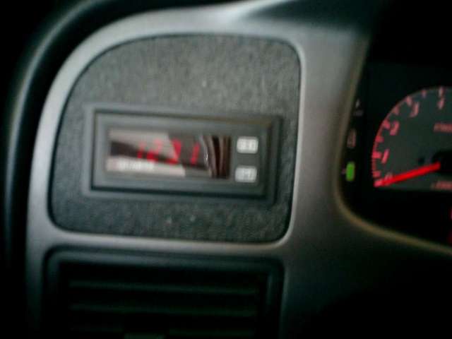 digital clock in fuzzy hole