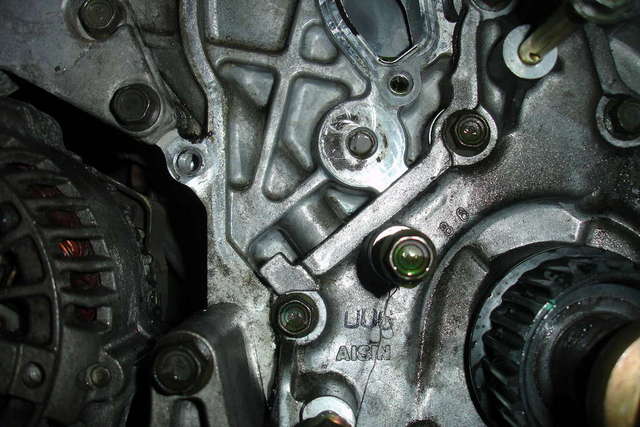 Look ... No hole for tensioner retaining bolt.