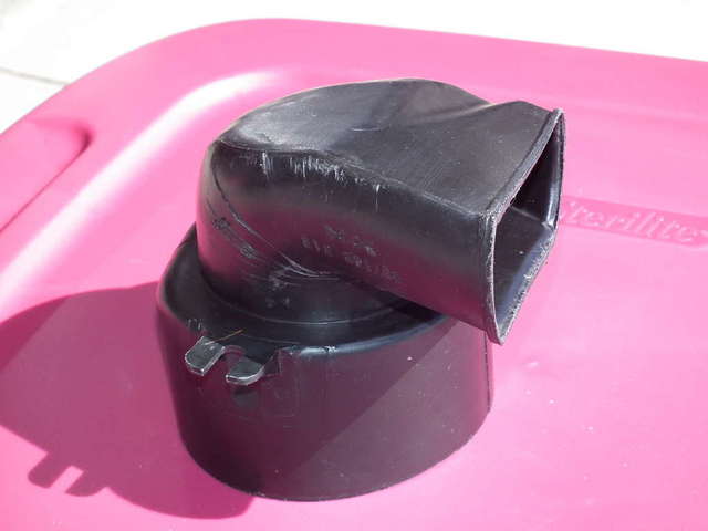 Black plastic elbow shaped piece (??)