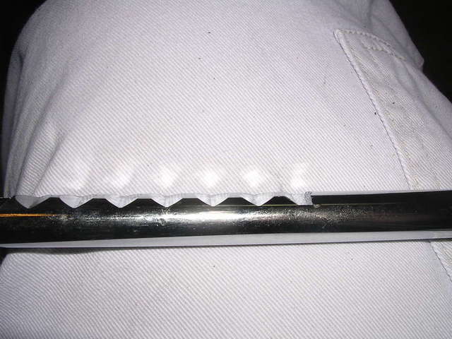 Flat tooth at bottom holds headrest securely