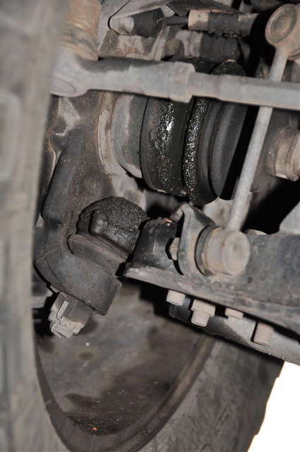 TORN CV BOOT- PASS SIDE