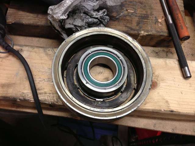 Pulley with new bearing, showing stakes