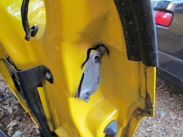Torn rear door hinge (Upper)