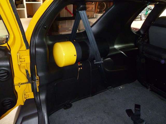 subwoofer strapped to side