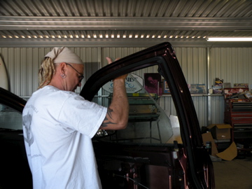 Tim at SBC installing window brackets