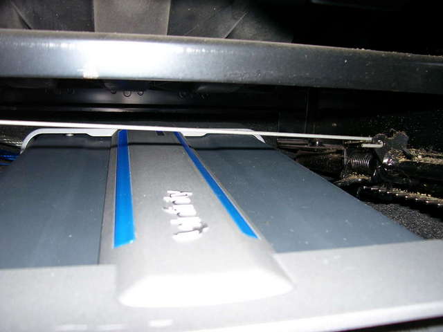 Hidden under Driver's seat.
