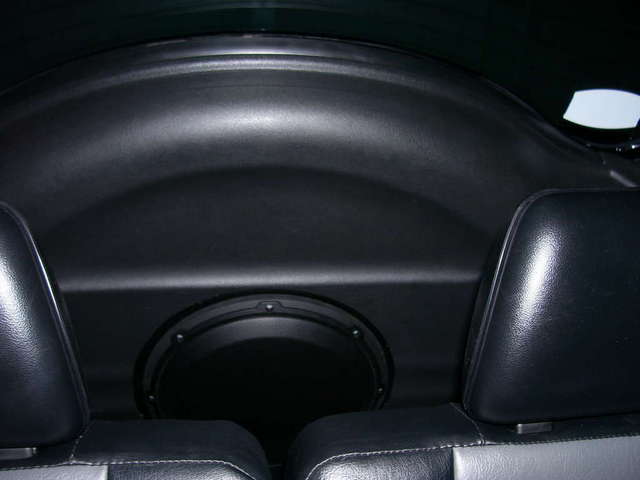 Sub in rear door behind seats.