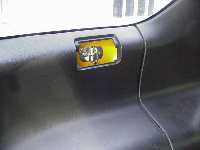 tiedown for seat belt hole